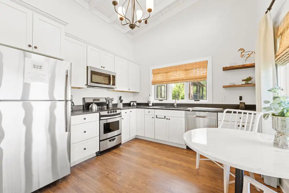 Kitchen with white cabinets.