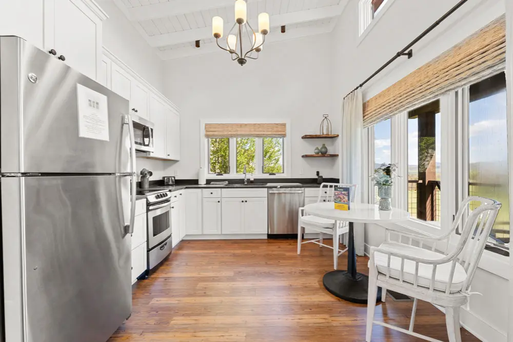 Kitchen with stainless steel appliances and wooden floors