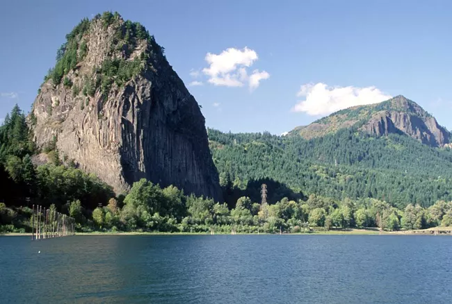 Sea with a beacon rock.