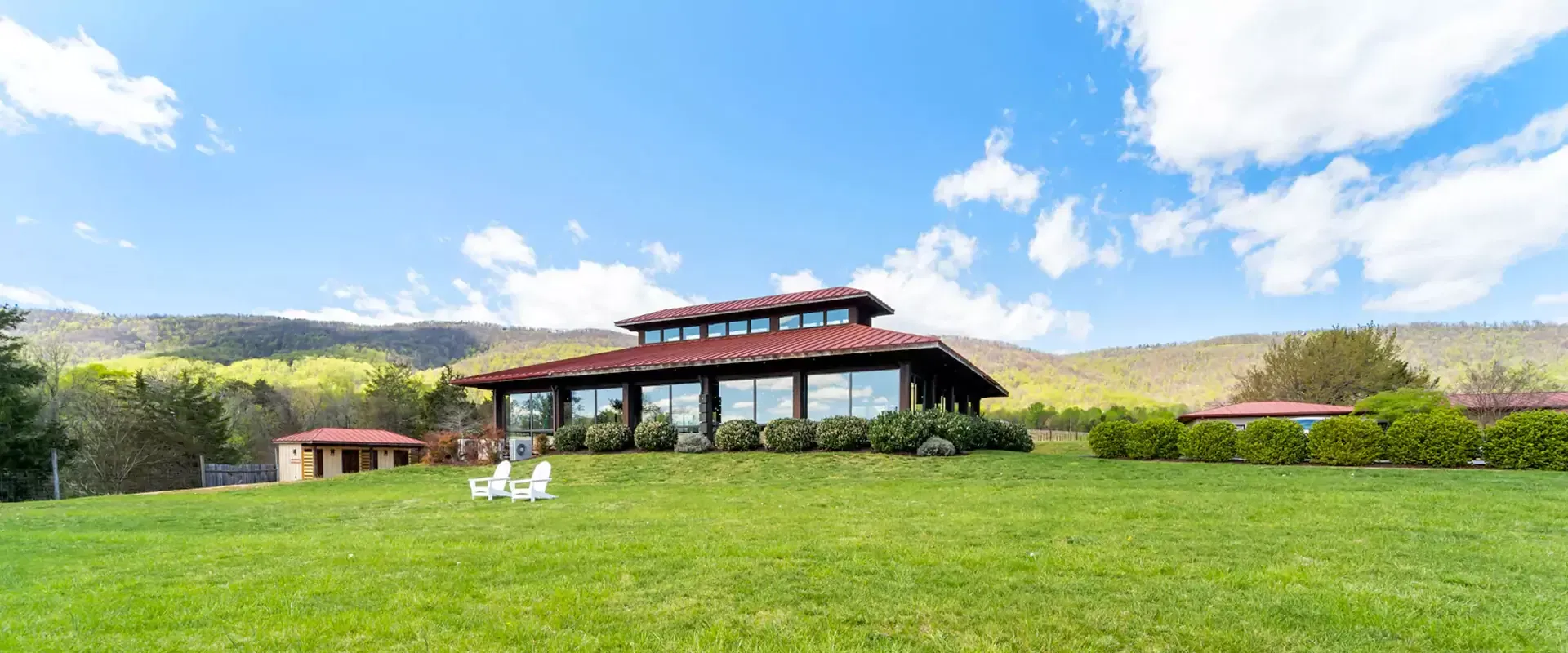 Tasting room with a vineyard in the front.