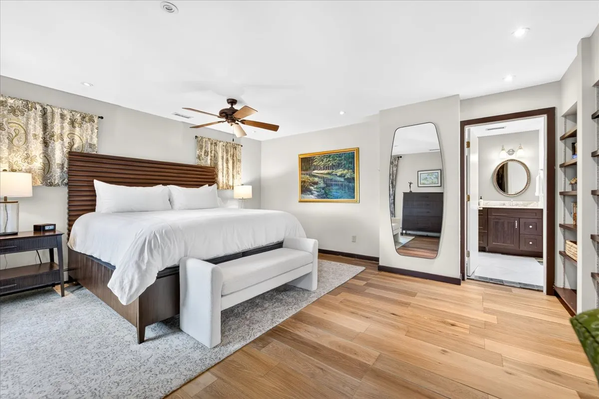 Primary bedroom with king bed and ensuite bathroom.