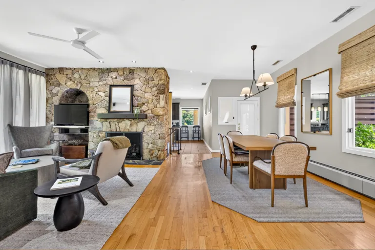 Spacious two-bedroom cottage with stone fireplace and open living area.